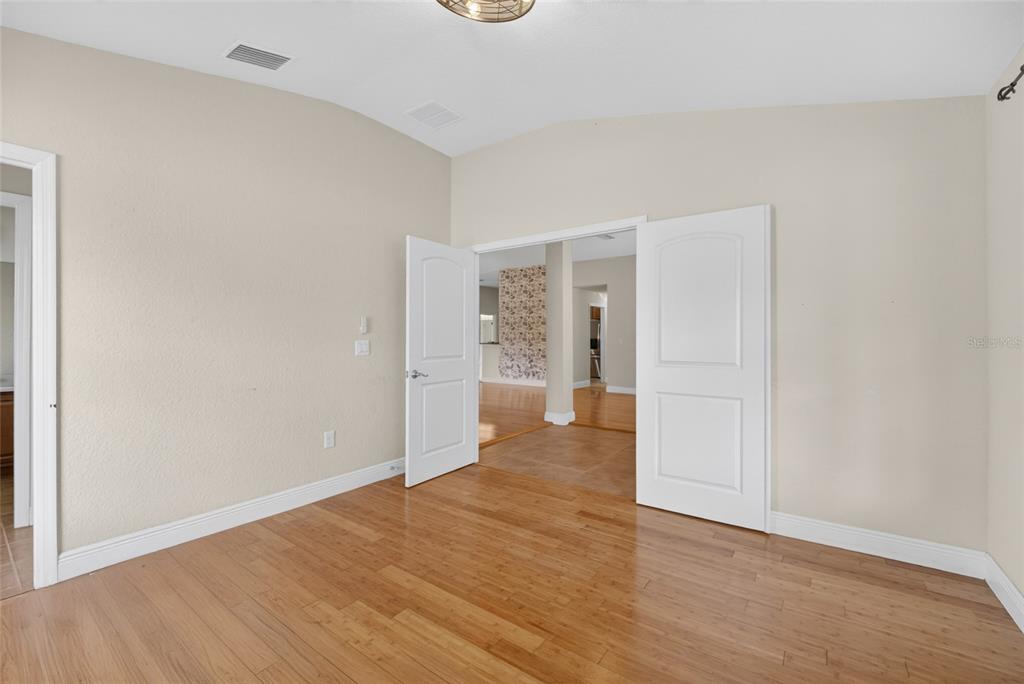4319 Southwest 63rd Street Ocala, FL 34474 - Photo 6 of 29 a view of a hallway with wooden floor