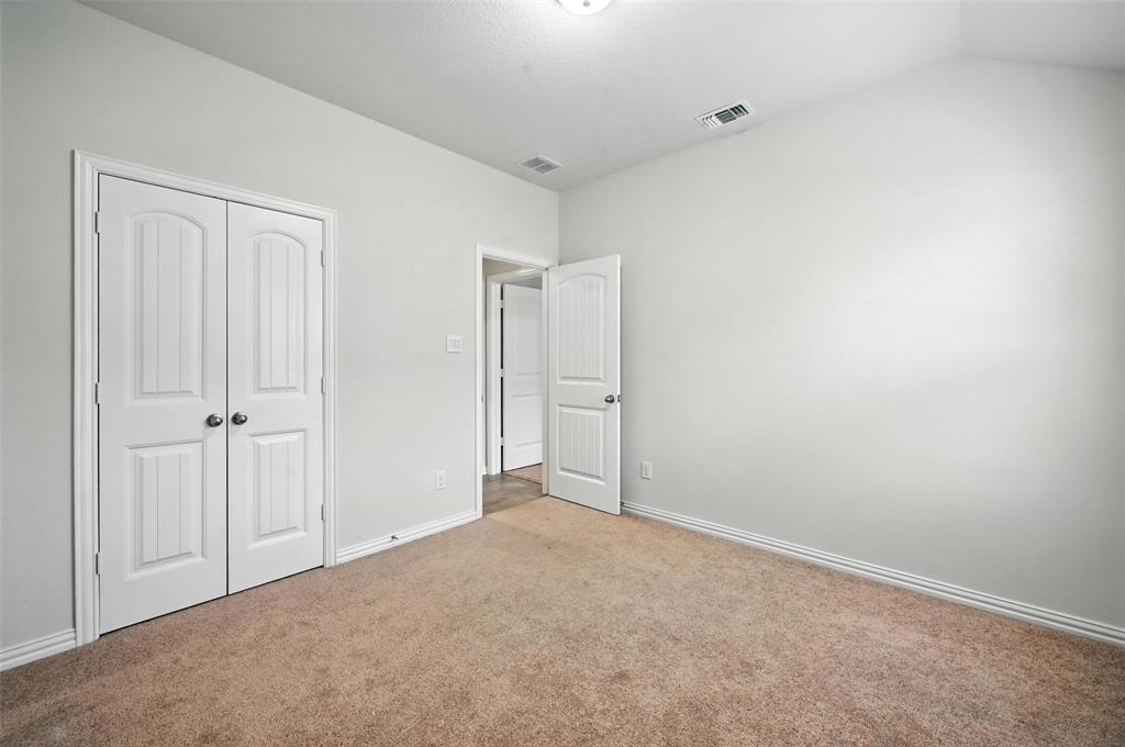 5 Pheasant Run Sanger, TX 76266 - Photo 13 of 27 Unfurnished bedroom with carpet floors and a closet
