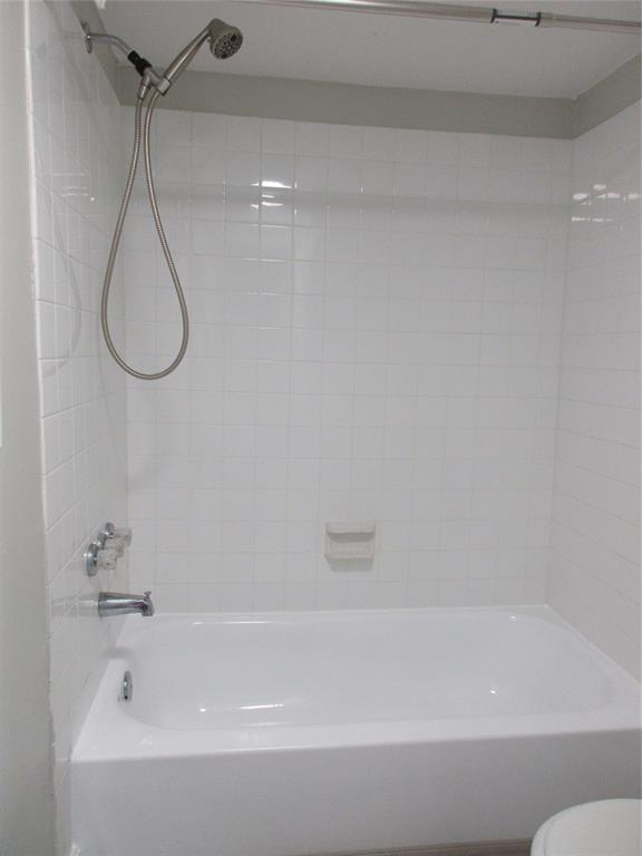 4240 Woodside Drive, Unit 4 Coral Springs, FL 33065 - Photo 11 of 13 a bathroom with a bath tub with a shower