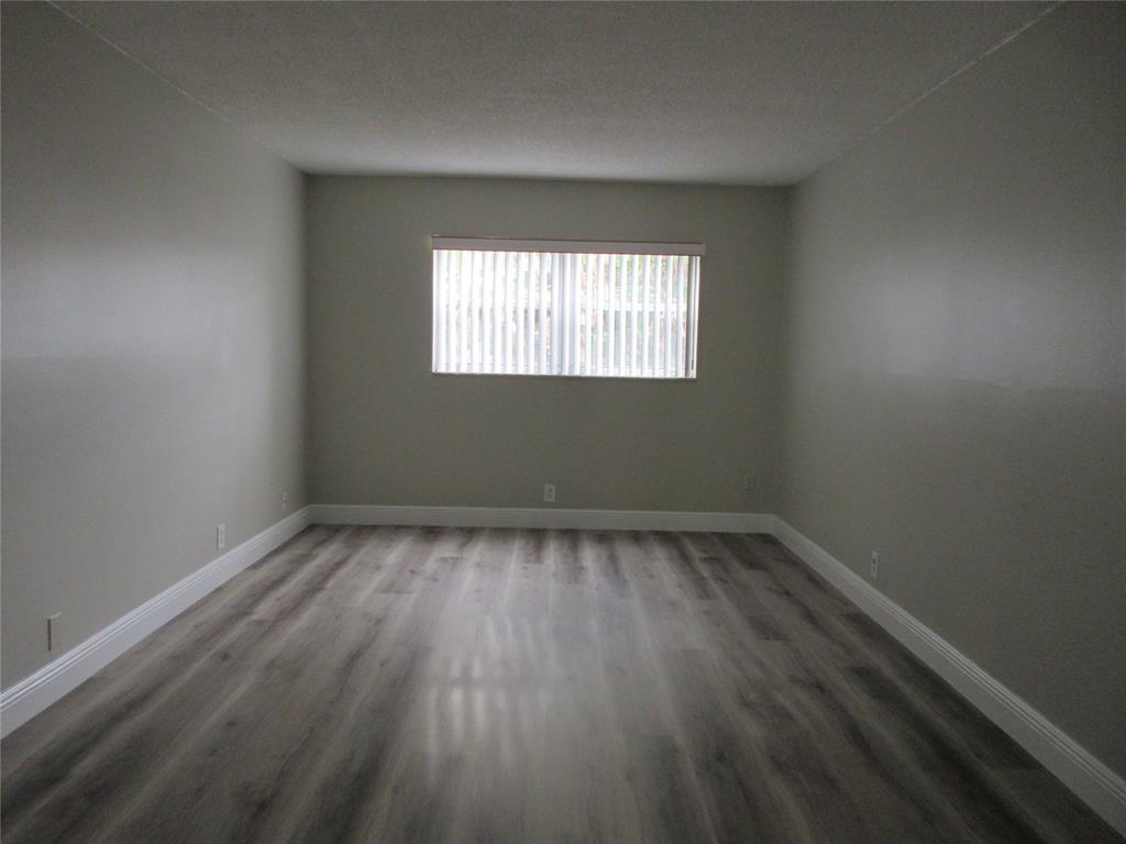 4240 Woodside Drive, Unit 4 Coral Springs, FL 33065 - Photo 9 of 13 an empty room that has a window