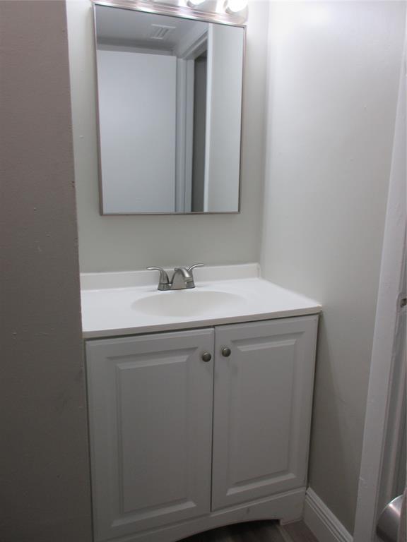 4240 Woodside Drive, Unit 4 Coral Springs, FL 33065 - Photo 10 of 13 a bathroom with a sink and a mirror