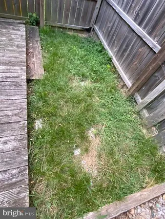 a view of backyard with tub