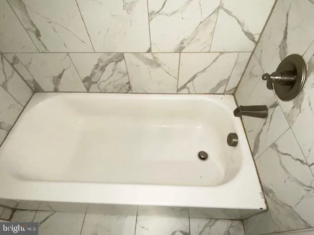 a bathroom with a sink and shower