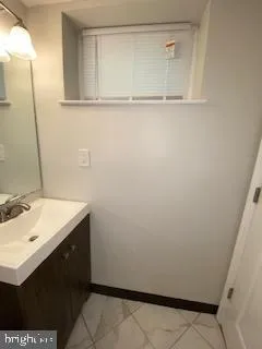 a view of an empty room and wooden floor