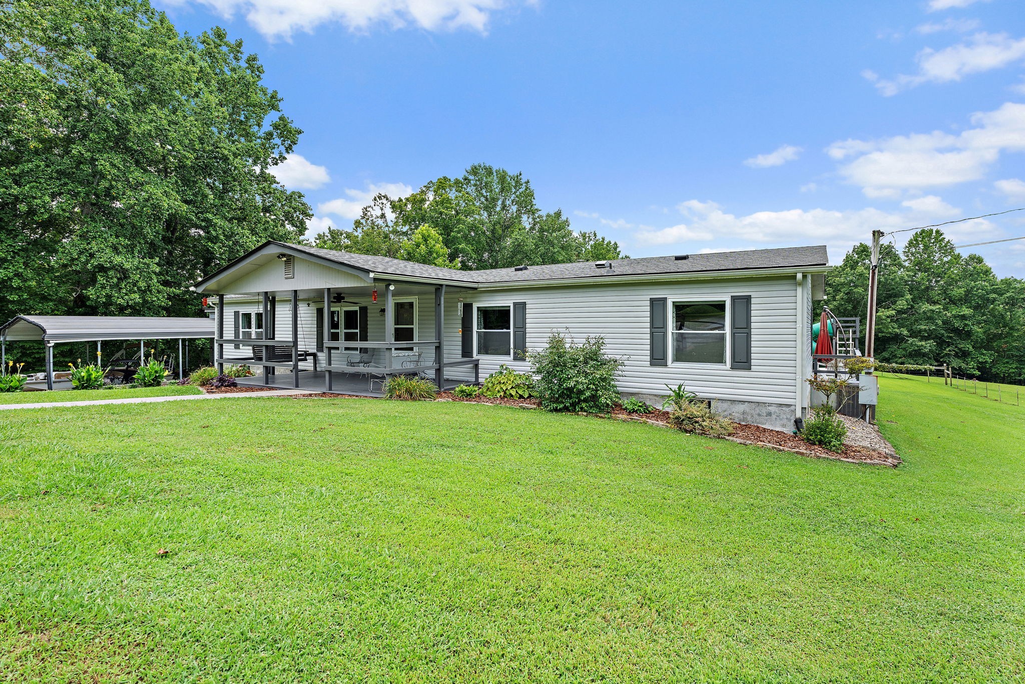 1333 Roberts Road Goodlettsville, TN 37072 - Photo 2 of 80 a front view of a house with a yard table and chairs