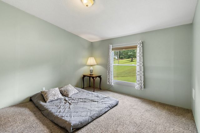 a view of a two chairs in a backyard