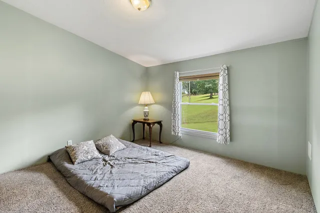 a view of a two chairs in a backyard