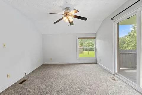 a backyard of a house with lots of green space