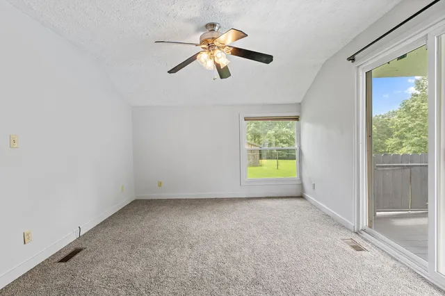 a backyard of a house with lots of green space