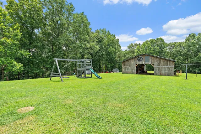a view of a city with lush green forest