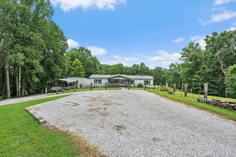 a view of a swimming pool with a yard