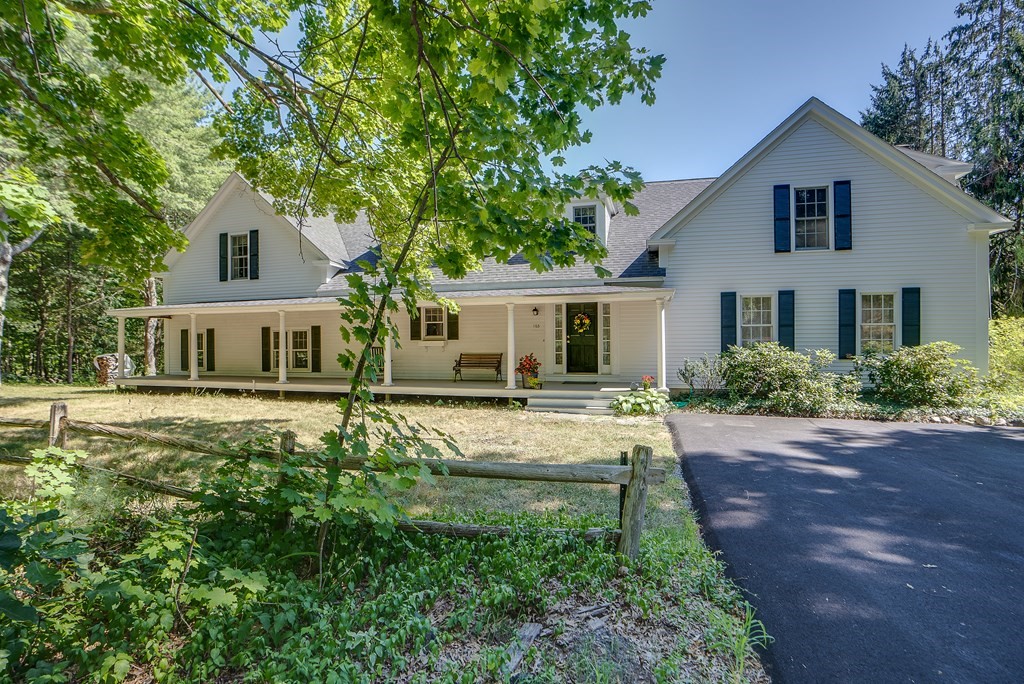 163 Still River Road Harvard, MA 01451 - Photo 1 of 42 a front view of a house with a yard