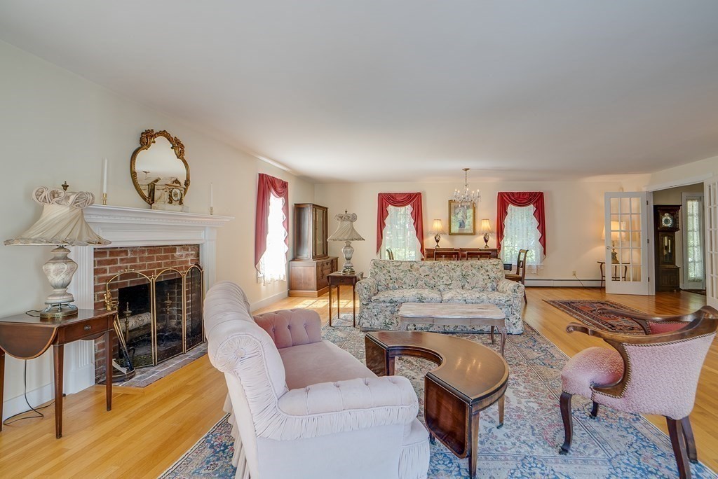 163 Still River Road Harvard, MA 01451 - Photo 16 of 42 a living room with furniture and a fireplace