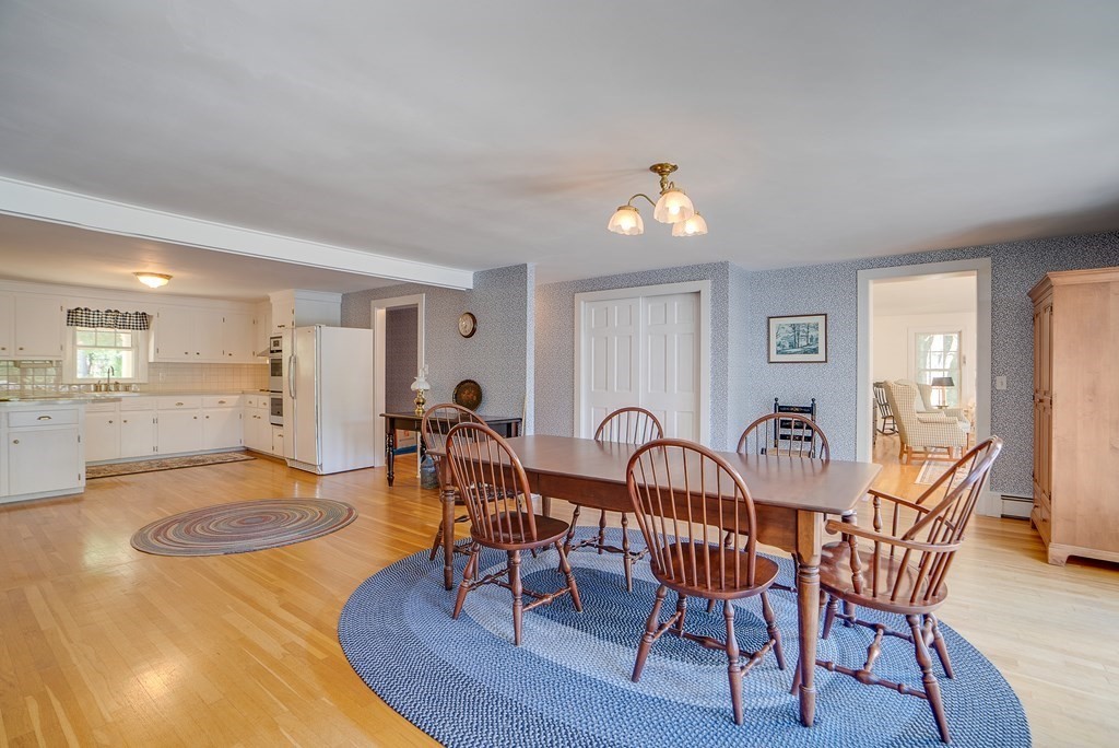 163 Still River Road Harvard, MA 01451 - Photo 18 of 42 a view of a dining room with furniture window and wooden floor