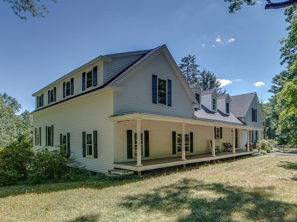 163 Still River Road Harvard, MA 01451 - Photo 2 of 42 a front view of a house with a yard