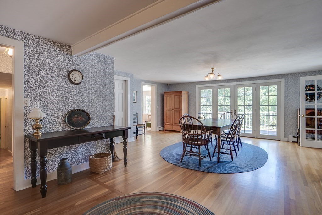 163 Still River Road Harvard, MA 01451 - Photo 21 of 42 a view of a dining room with furniture and wooden floor