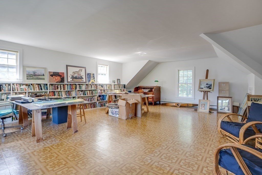 163 Still River Road Harvard, MA 01451 - Photo 27 of 42 a living room with furniture a rug and a large window