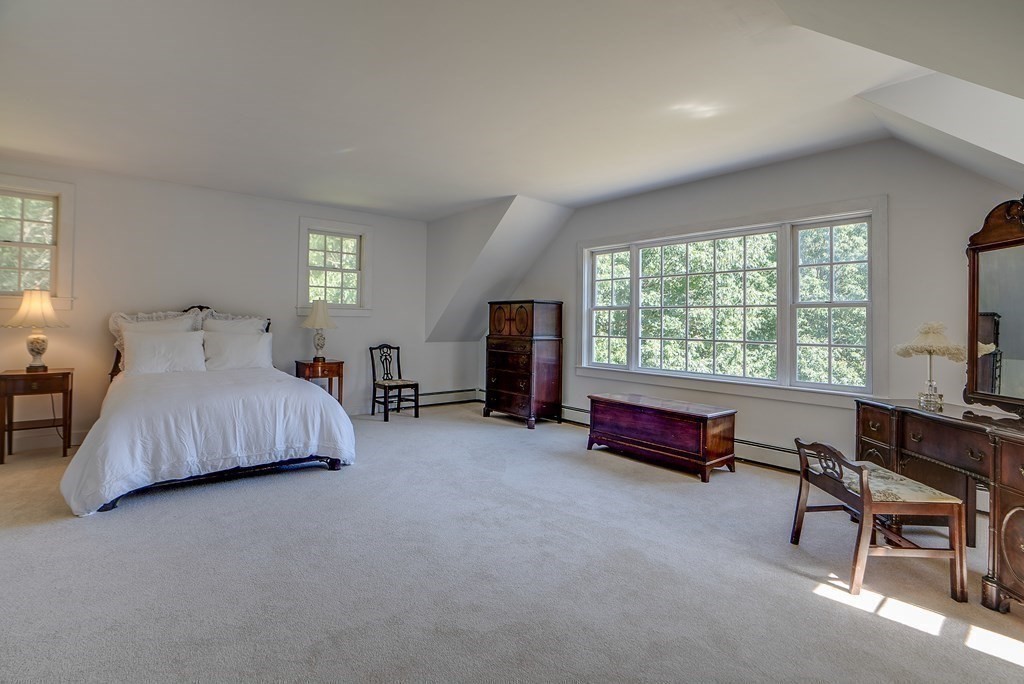 163 Still River Road Harvard, MA 01451 - Photo 28 of 42 a bedroom with furniture and a bed