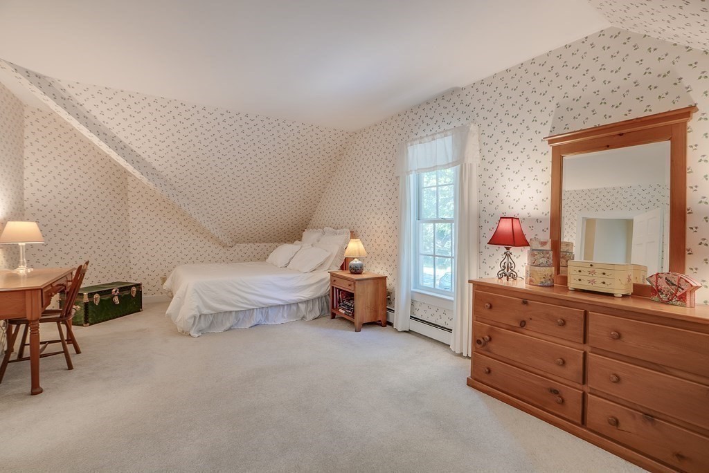 163 Still River Road Harvard, MA 01451 - Photo 30 of 42 a bedroom with a bed and a dresser in it