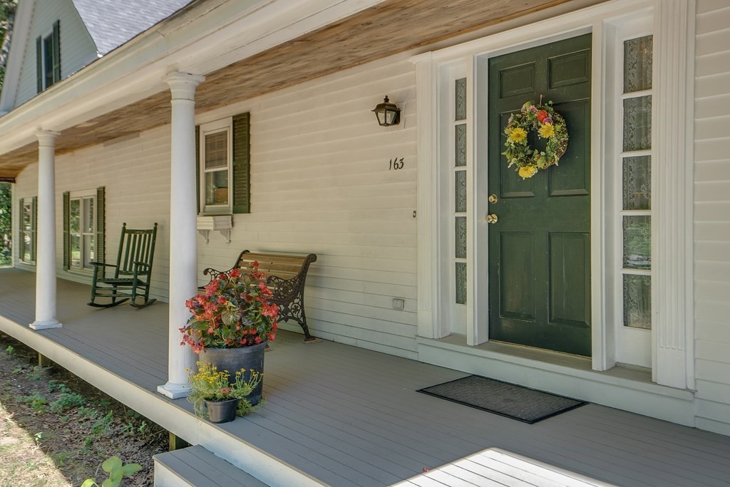 163 Still River Road Harvard, MA 01451 - Photo 10 of 42 a front view of a house with outdoor seating