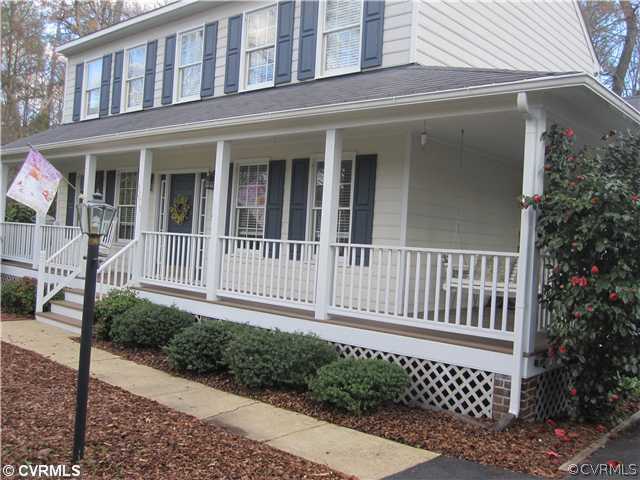 9279 Drawbridge Road Mechanicsville, VA 23116 - Photo 2 of 14 a view of a house with a small yard and wooden fence