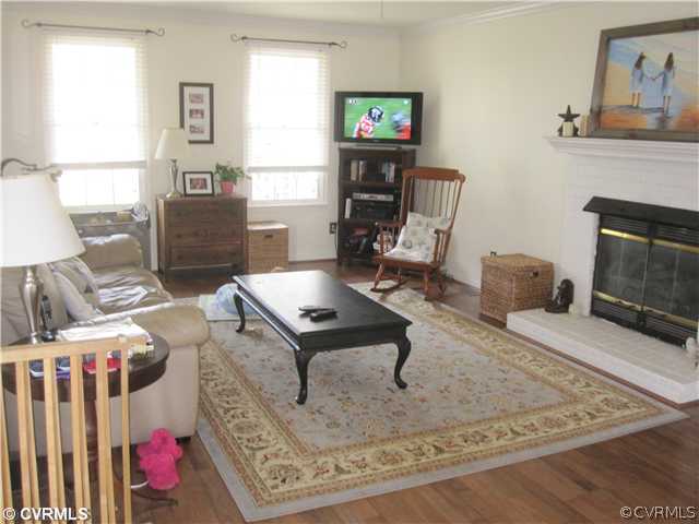 9279 Drawbridge Road Mechanicsville, VA 23116 - Photo 3 of 14 a living room with furniture and a fireplace