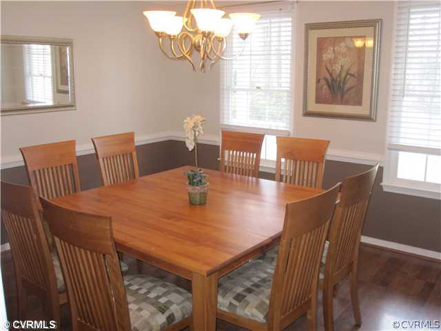 9279 Drawbridge Road Mechanicsville, VA 23116 - Photo 7 of 14 a view of a dining room with furniture and wooden floor