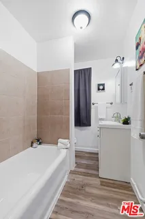 a bathroom with a bathtub and a sink
