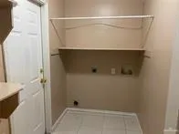 view of a room with rack on the wall