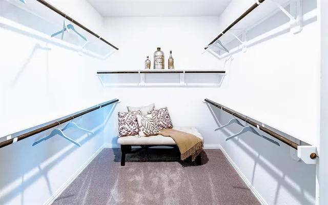 a living room with furniture and a ceiling fan