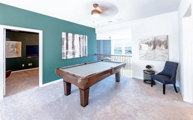 a living room with furniture and a table