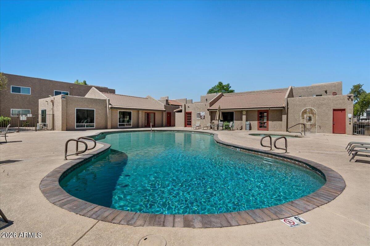 5525 East Thomas Road, Unit O12 Phoenix, AZ 85018 - Photo 26 of 27 a view of a house with swimming pool and porch