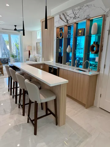 a large kitchen with lots of counter space and windows