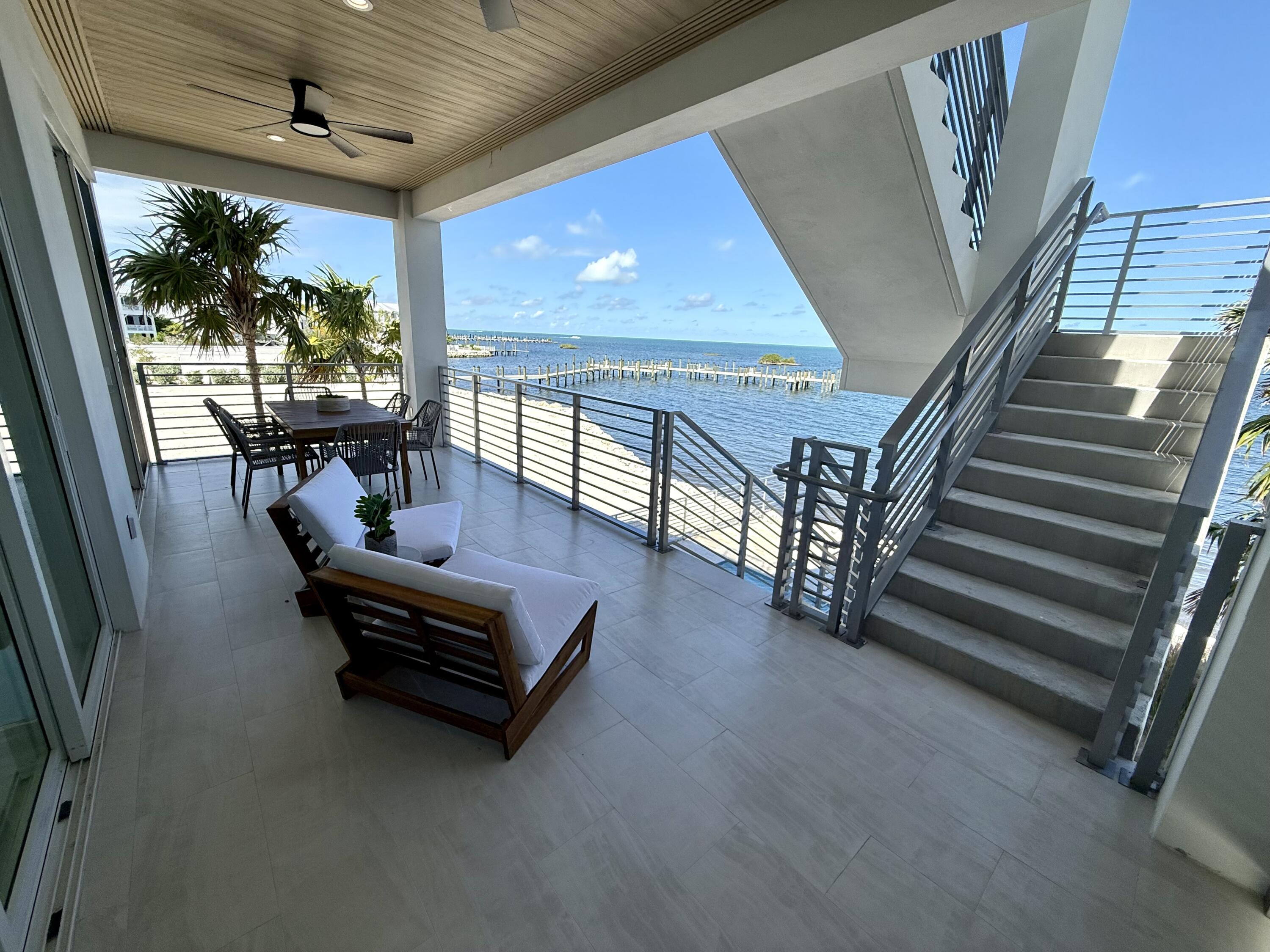 990 41st Street, Unit 9 Marathon, FL 33050 - Photo 20 of 52 a living room with furniture and a floor to ceiling window