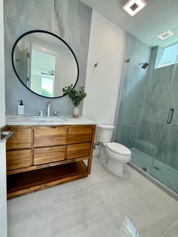 a bathroom with a sink and shower