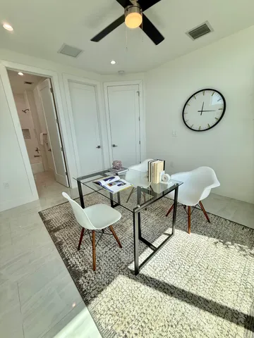 a bathroom with a double vanity sink toilet and shower