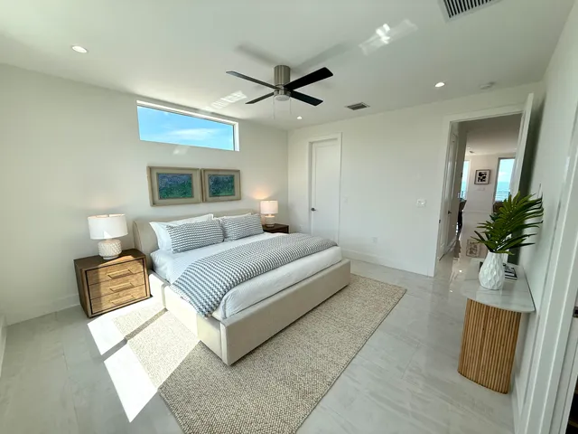 a bedroom with a large bed and a couch