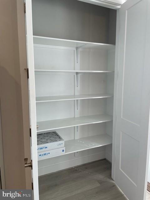 1955 Roland Clarke Place, Unit 29 Reston, VA 20191 - Photo 13 of 27 DOUBLE DOOR PANTRY IN KITCHEN