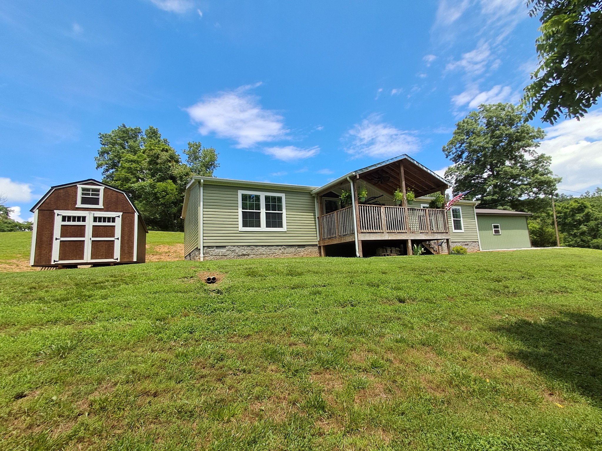 5525 Wiley Hollow Road Culleoka, TN 38451 - Photo 3 of 64 a view of a house with a big yard potted plants and large tree