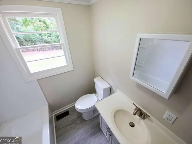 a bathroom with a sink and a toilet