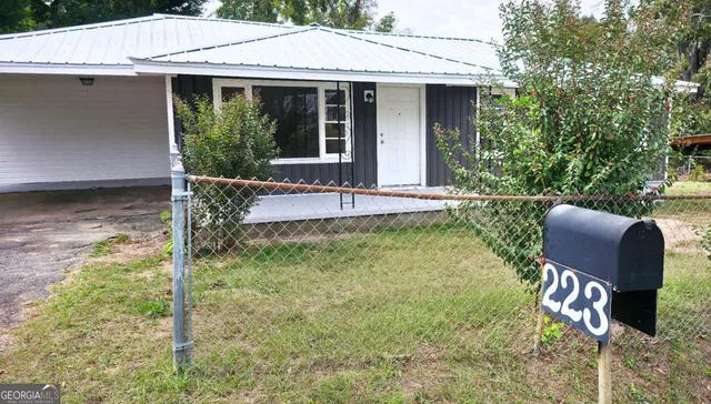 a backyard of a house with seating space