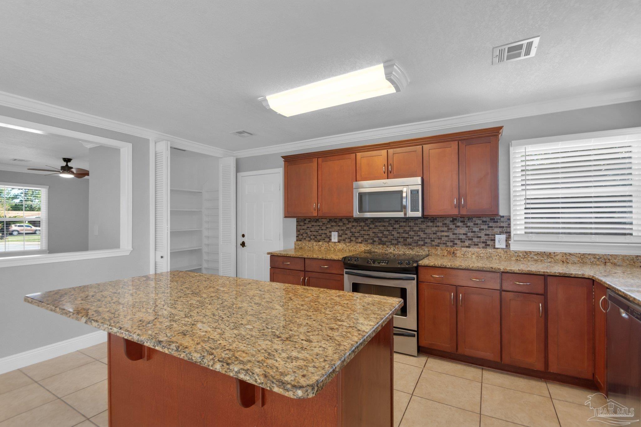 5545 Homewood Road Pensacola, FL 32504 - Photo 8 of 42 The island has cabinets and drawers