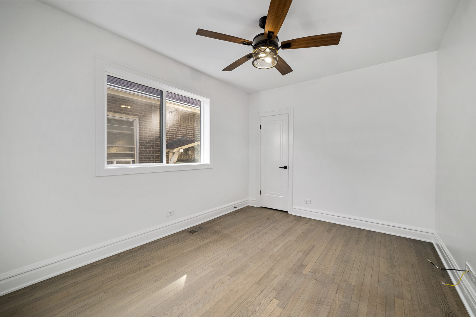 6747 Riverside Drive Berwyn, IL 60402 - Photo 16 of 32 a view of empty room with wooden floor