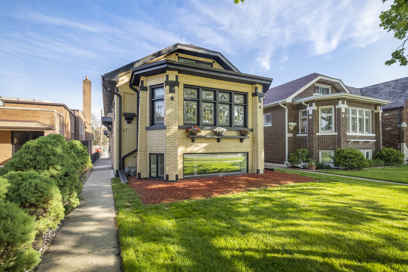 6747 Riverside Drive Berwyn, IL 60402 - Photo 2 of 32 a front view of a house with a yard