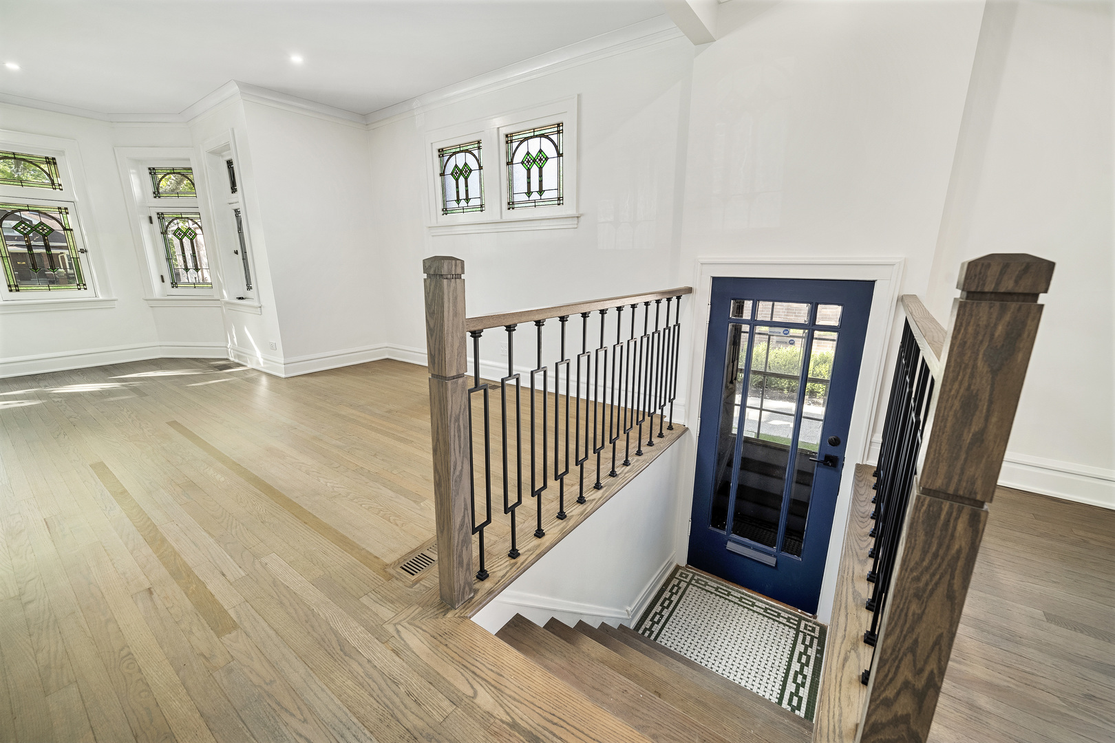 6747 Riverside Drive Berwyn, IL 60402 - Photo 6 of 32 a view of a hallway with wooden floor and stairs