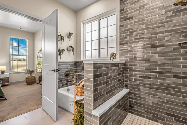 a bathroom with a double vanity sink and a mirror