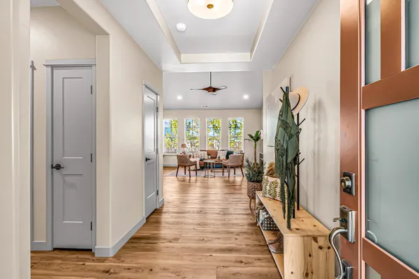 a very nice looking room with a large window and wooden floor