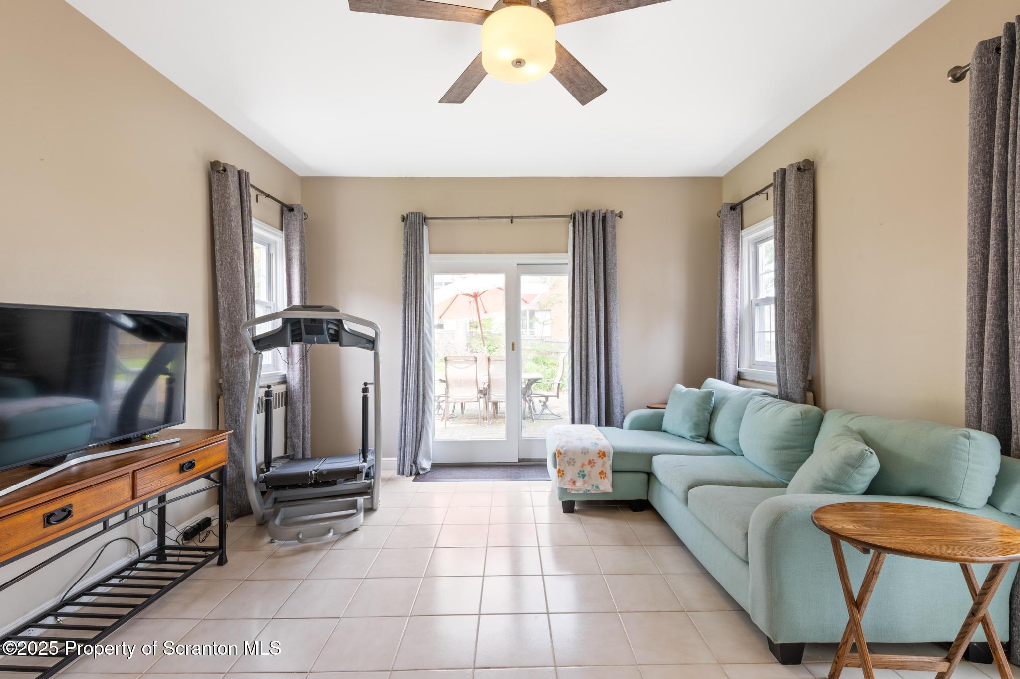 114 Spring Street Clarks Green, PA 18411 - Photo 12 of 47 a living room with furniture and a flat screen tv