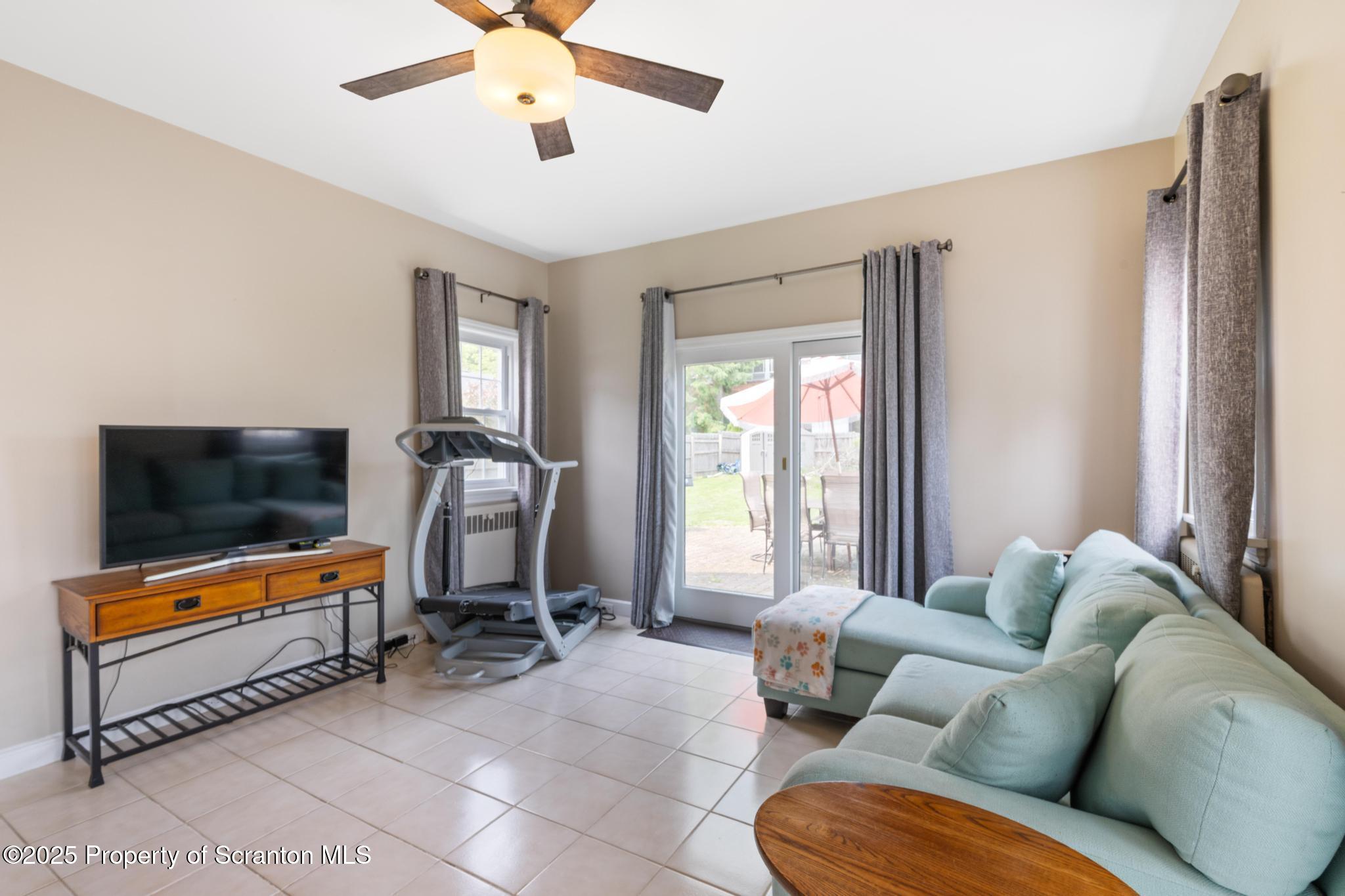 114 Spring Street Clarks Green, PA 18411 - Photo 13 of 47 a living room with furniture and a flat screen tv