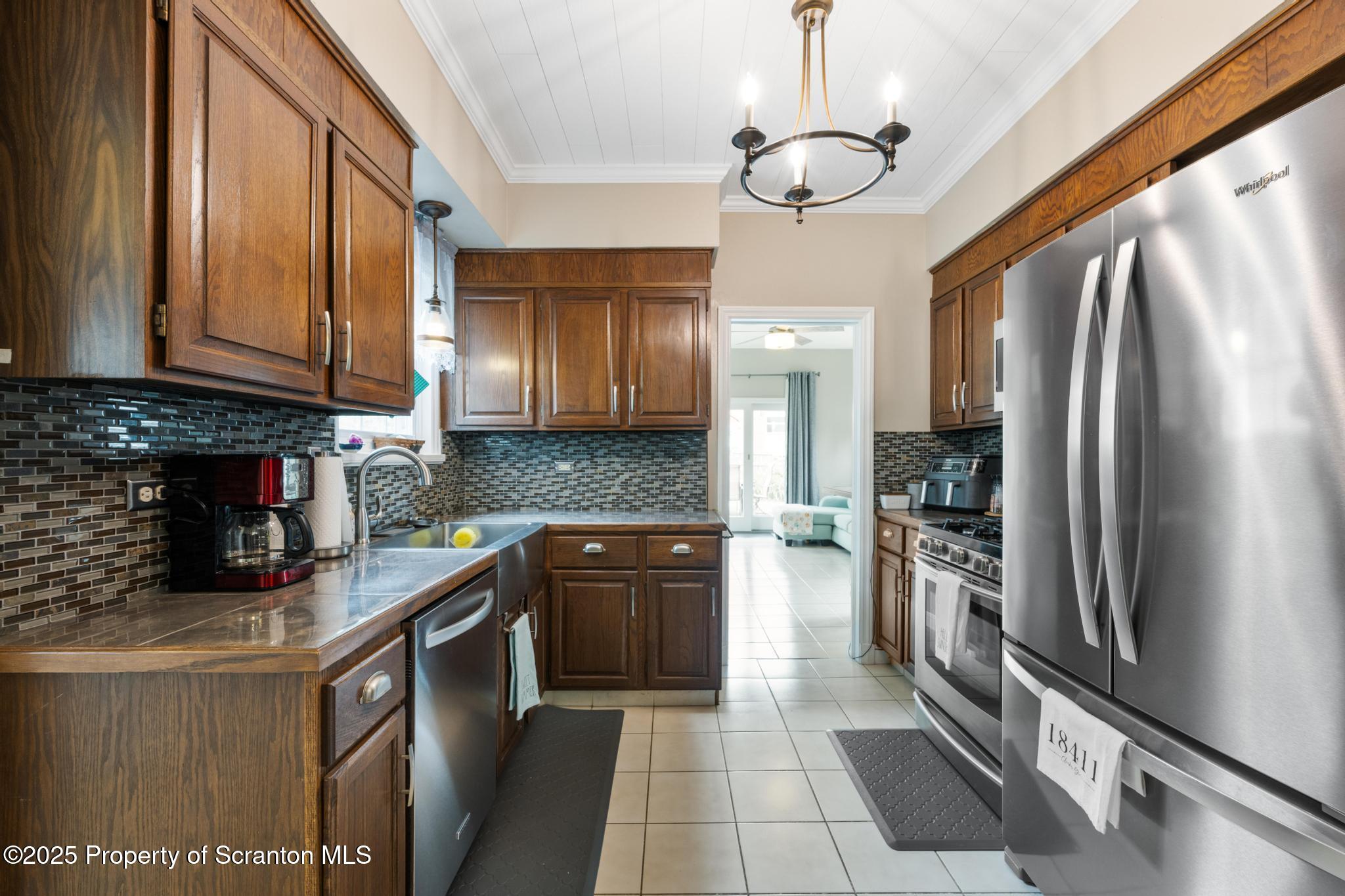 114 Spring Street Clarks Green, PA 18411 - Photo 16 of 47 a kitchen with stainless steel appliances granite countertop a refrigerator a stove and a sink